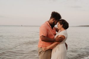 a man and a woman hugging each other