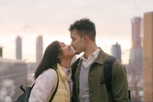 a guy and a girl kissing