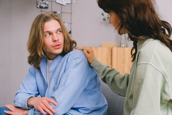 woman touches man